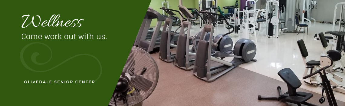 Members using exercise equipment in the fitness room